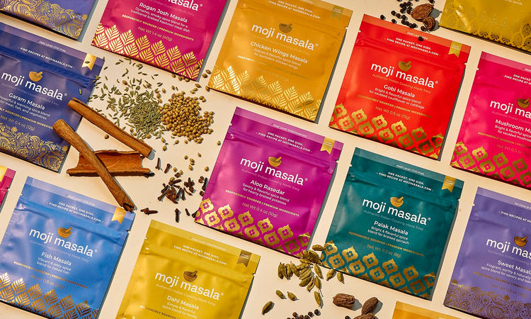 Assorted moji masala®  spice packets on a light background